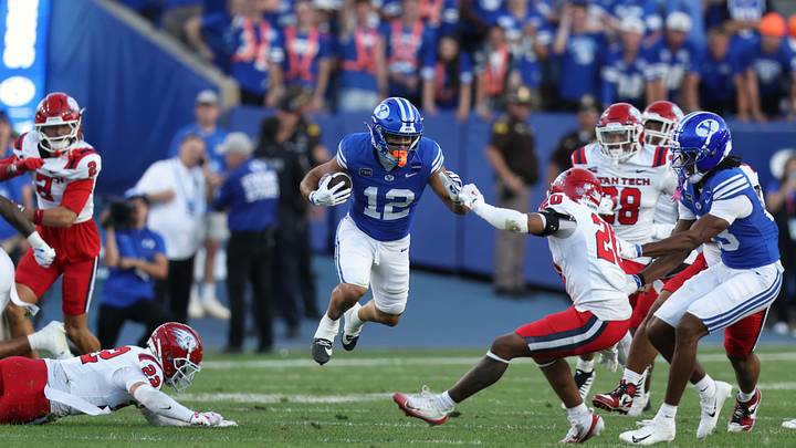 Sep 5, 2026; Provo, Utah, USA;  BYU Cougars running back Preston Rex (12) leaps while running the ball against the Utah Tech Trailblazers during the second quarter at LaVell Edwards Stadium.  Mandatory Credit: Rob Gray-Imagn Images