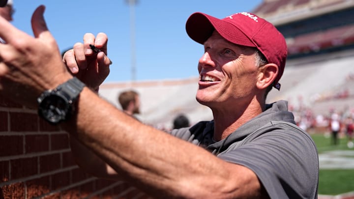 Oklahoma head football coach Brent Venables greets fans at the Crimson Combine. Oklahoma head football coach Brent Venables greets fans at the Crimson Combine.