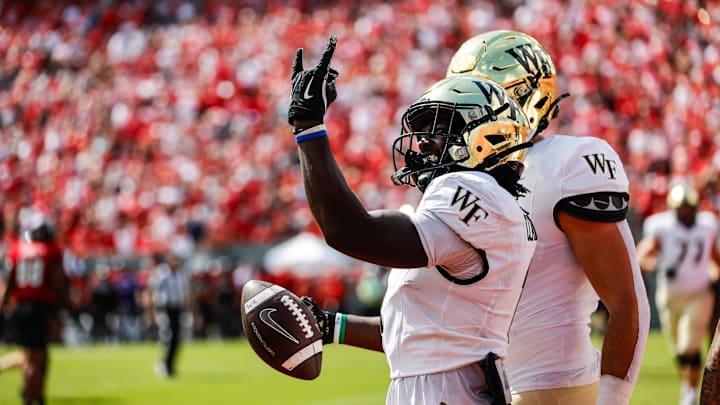 Oct 5, 2024; Raleigh, North Carolina, USA; Wake Forest Demon Deacons running back Demond Claiborne (1) celebrates a touchdown during the first half of the game against North Carolina State Wolfpack at Carter-Finley Stadium. Mandatory Credit: Jaylynn Nash-Imagn Images
