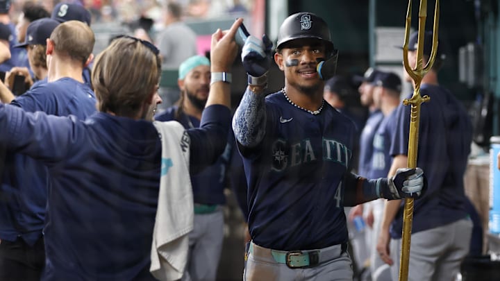 Seattle Mariners center fielder Julio Rodriguez celebrates after hitting a home run against the Texas Rangers on Friday at Globe Life Field.