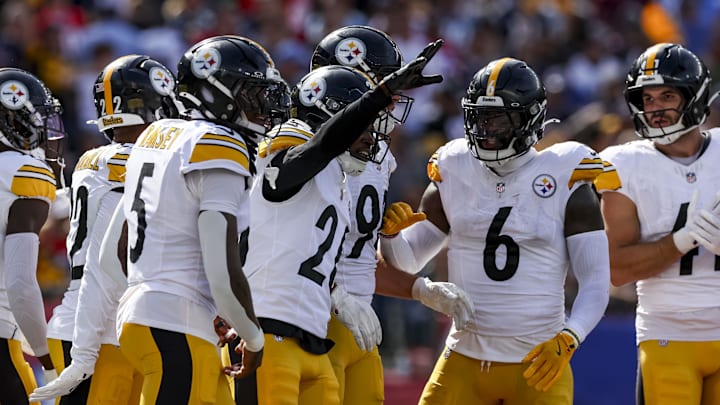 Sep 21, 2025; Foxborough, Massachusetts, USA; Pittsburgh Steelers cornerback Brandin Echols (26) celebrates after an interception during the second quarter at Gillette Stadium. Mandatory Credit: Paul Rutherford-Imagn Images