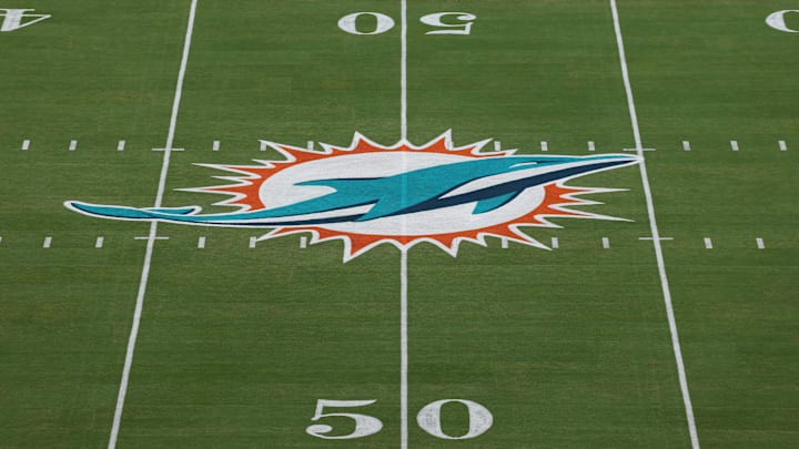 The Miami Dolphins logo is seen at midfield prior to a game against the Baltimore Ravens at Hard Rock Stadium.