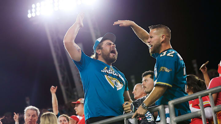 Jacksonville Jaguars fans and lifelong friends Seth Thomas, left, high-fives Camerson Teems, both of Lake City, Fla. after a pick six touchdown score during the third quarter of an NFL football matchup at EverBank Stadium, Monday, Oct. 6, 2025, in Jacksonville, Fla. The Jacksonville Jaguars edged the Kansas City Chiefs 31-28. [Corey Perrine/Florida Times-Union]
