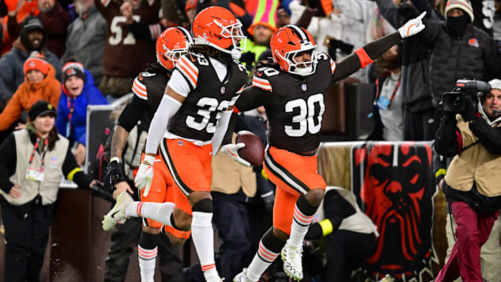 Nov 16, 2025; Cleveland, Ohio, USA; Cleveland Browns linebacker Devin Bush (30) celebrates with safety Ronnie Hickman Jr. (33) after returning an interception for a touchdown during the second quarter against the Baltimore Ravens at Huntington Bank Field. Mandatory Credit: Ken Blaze-Imagn Images