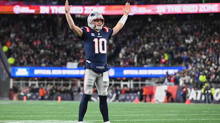 Jan 4, 2026; Foxborough, Massachusetts, USA; New England Patriots quarterback Drake Maye (10) reacts to a Patriots touchdown scored against the Miami Dolphins during the first quarter at Gillette Stadium. Mandatory Credit: Brian Fluharty-Imagn Images