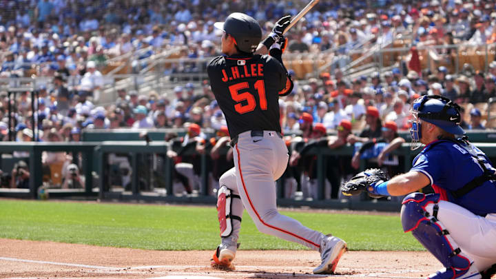 Mar 1, 2025; Phoenix, Arizona, USA; San Francisco Giants outfielder Jung Hoo Lee (51) hits against the Los Angeles Dodgers during the first inning at Camelback Ranch-Glendale. 