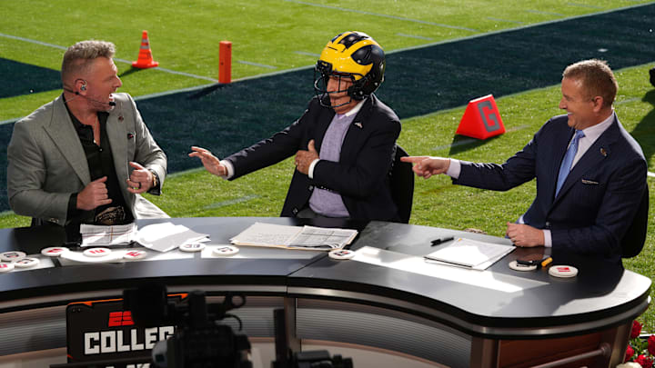 Jan 1, 2024; Pasadena, CA, USA; Pat McAfee (left), Lee Corso (center) and Kirk Herbstreit on the ESPN College Gameday set at the 2024 Rose Bowl college football playoff semifinal game at Rose Bowl. Mandatory Credit: Kirby Lee-Imagn Images