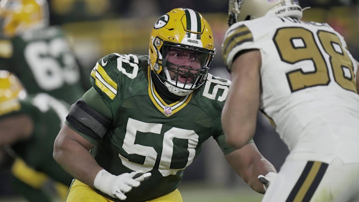 Dec 23, 2024; Green Bay, Wisconsin, USA;  Green Bay Packers guard Zach Tom (50) blocks New Orleans Saints defensive end Payton Turner (98) during the third quarter at Lambeau Field. Mandatory Credit: Mark Hoffman/Milwaukee Journal Sentinel/Imagn Images