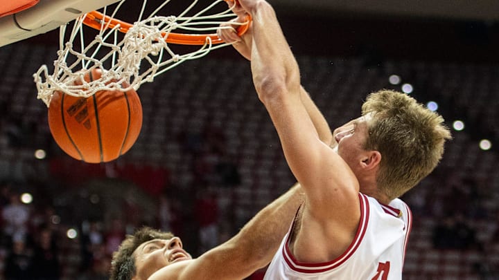 Indiana basketball's Trent Sisley (11) dunks over Marian's Luke Carroll (20) on Oct. 17, 2025, at Simon Skjodt Assembly Hall.