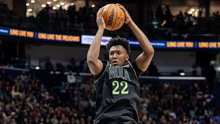 Dec 29, 2025; New Orleans, Louisiana, USA;  New Orleans Pelicans center Derik Queen (22) grabs a rebound against the New York Knicksduring the second half at Smoothie King Center. 