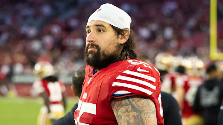 Dec 17, 2023; Glendale, Arizona, USA; San Francisco 49ers guard Jon Feliciano (55) against the Arizona Cardinals at State Farm Stadium. Mandatory Credit: Mark J. Rebilas-Imagn Images