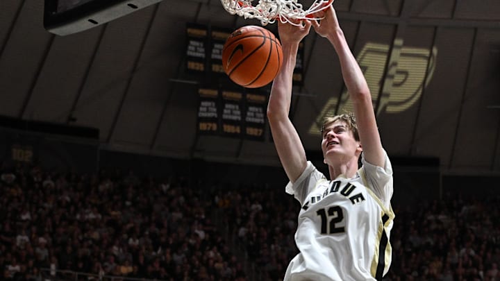 Purdue Boilermakers center Daniel Jacobsen (12) dunks the ball Purdue Boilermakers center Daniel Jacobsen (12) dunks the ball