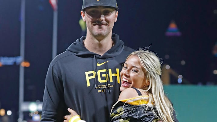 Pittsburgh Pirates starting pitcher Paul Skenes (30) poses with his girlfriend Louisiana State University gymnast Livvy Dunne (right) after Skenes made his major league debut against the Chicago Cubs at PNC Park.