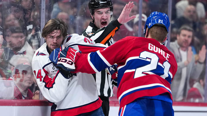 Feb 28, 2026; Montreal, Quebec, CAN; referee Cody Beach (12) stops the fight between Washington Capitals forward Connor McMichael (24) and Montreal Canadiens defenseman Kaiden Guhle (21) during the third period at the Bell Centre. Mandatory Credit: Eric Bolte-Imagn Images Feb 28, 2026; Montreal, Quebec, CAN; referee Cody Beach (12) stops the fight between Washington Capitals forward Connor McMichael (24) and Montreal Canadiens defenseman Kaiden Guhle (21) during the third period at the Bell Centre. Mandatory Credit: Eric Bolte-Imagn Images
