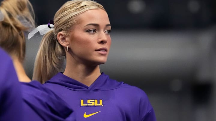 LSU gymnast Livvy Dunne stretches with teammates before Session 2 of the SEC Gymnastics Tournament at Legacy Arena in Birmingham, Alabama.
