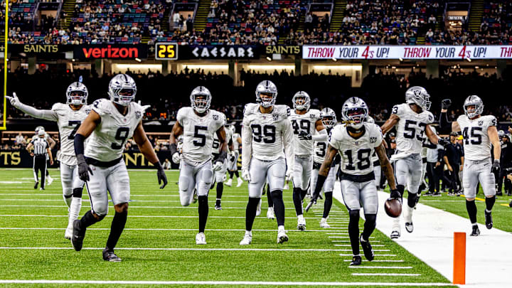 Dec 29, 2024; New Orleans, Louisiana, USA;  Las Vegas Raiders cornerback Jack Jones (18) reacts to intercepting a play from New Orleans Saints quarterback Spencer Rattler (18) during the second half at Caesars Superdome. Mandatory Credit: Stephen Lew-Imagn Images