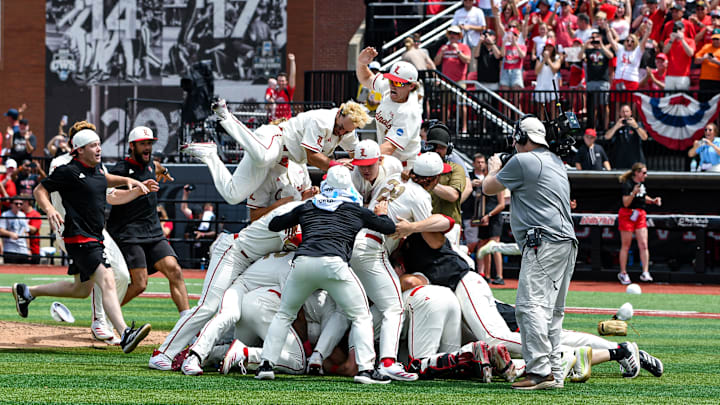 Louisville baseball players celebrate after defeating Miami in game three of the 2025 Louisville Super Regional.