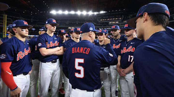 Ole Miss baseball coach Mike Bianco talks to players before the game against the Texas Longhorns at the Shriners Children's College Showdown in Arlington, Texas.