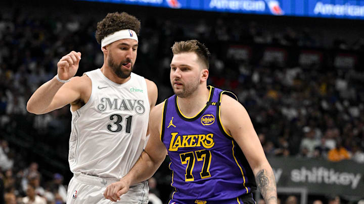 Apr 9, 2025; Dallas, Texas, USA; Dallas Mavericks guard Klay Thompson (31) and Los Angeles Lakers guard Luka Doncic (77) in action during the game between the Dallas Mavericks and the Los Angeles Lakers at American Airlines Center. Mandatory Credit: Jerome Miron-Imagn Images