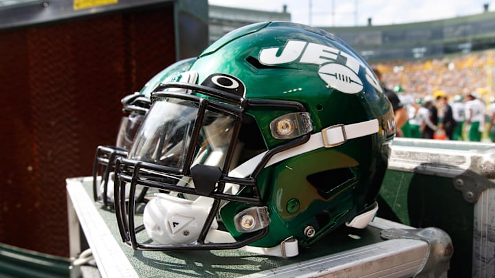Aug 21, 2021; Green Bay, Wisconsin, USA;  New York Jets helmets sit on the sidelines during the game against the Green Bay Packers at Lambeau Field. Mandatory Credit: Jeff Hanisch-Imagn Images
