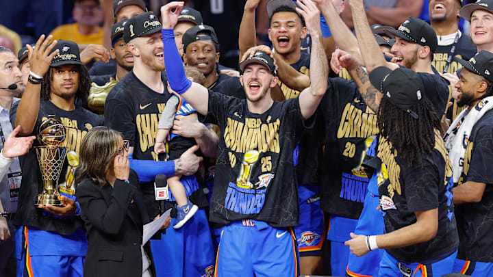 Jun 22, 2025; Oklahoma City, Oklahoma, USA; Oklahoma City Thunder guard Alex Caruso (9) during the NBA Championship trophy presentation after game seven of the 2025 NBA Finals against the Indiana Pacers at Paycom Center. Mandatory Credit: Alonzo Adams-Imagn Images Jun 22, 2025; Oklahoma City, Oklahoma, USA; Oklahoma City Thunder guard Alex Caruso (9) during the NBA Championship trophy presentation after game seven of the 2025 NBA Finals against the Indiana Pacers at Paycom Center. Mandatory Credit: Alonzo Adams-Imagn Images