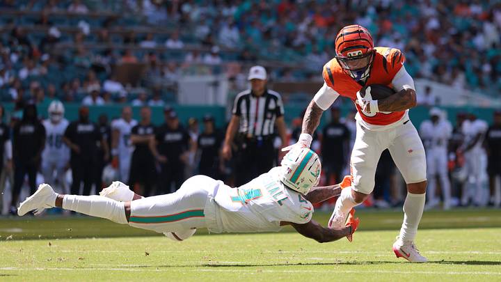Oct 11, 2026; Miami Gardens, Florida, USA; Cincinnati Bengals halfback Chase Brown (30) runs with the ball past Miami Dolphins cornerback Jason Marshall Jr. (4) during the game at Hard Rock Stadium. Mandatory Credit: Sam Navarro-Imagn Images Oct 11, 2026; Miami Gardens, Florida, USA; Cincinnati Bengals halfback Chase Brown (30) runs with the ball past Miami Dolphins cornerback Jason Marshall Jr. (4) during the game at Hard Rock Stadium. Mandatory Credit: Sam Navarro-Imagn Images
