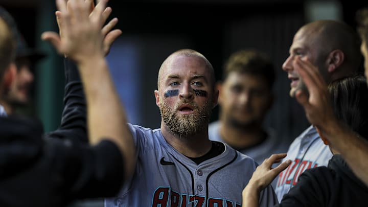 May 7, 2024; Cincinnati, Ohio, USA; Arizona Diamondbacks catcher Tucker Barnhart (16) high fives teammates after scoring on a RBI single hit by outfielder Corbin Carroll (not pictured) in the fifth inning against the Cincinnati Reds at Great American Ball Park. Mandatory Credit: Katie Stratman-Imagn Images May 7, 2024; Cincinnati, Ohio, USA; Arizona Diamondbacks catcher Tucker Barnhart (16) high fives teammates after scoring on a RBI single hit by outfielder Corbin Carroll (not pictured) in the fifth inning against the Cincinnati Reds at Great American Ball Park. Mandatory Credit: Katie Stratman-Imagn Images