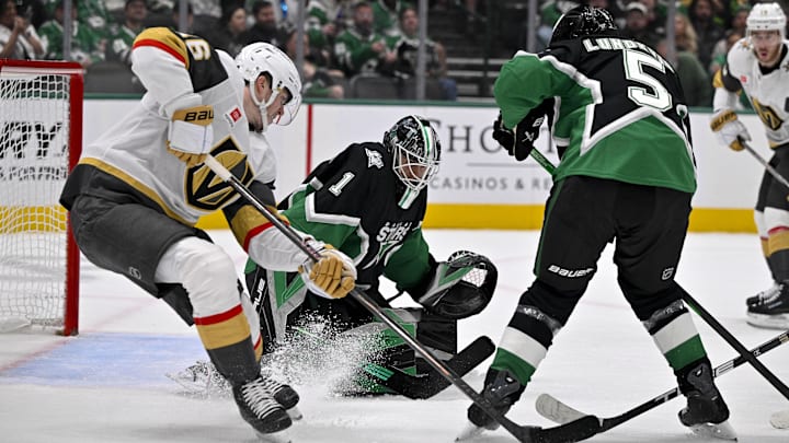 Mar 22, 2026; Dallas, Texas, USA; Vegas Golden Knights right wing Pavel Dorofeyev (16) attempts to poke the puck past Dallas Stars goaltender Casey DeSmith (1) and defenseman Nils Lundkvist (5) during the first period at the American Airlines Center. Mandatory Credit: Jerome Miron-Imagn Images