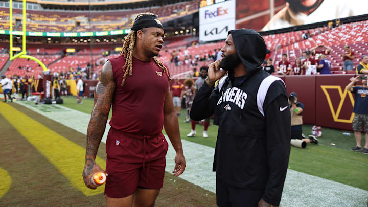 Baltimore Ravens wide receiver Odell Beckham Jr. (R) and Washington Commanders defensive end Chase Young (L)