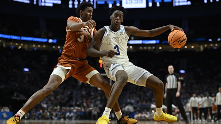 Mar 19, 2026; Portland, OR, USA; BYU Cougars forward AJ Dybantsa (3) dribbles against Texas Longhorns forward Dailyn Swain (3) in the second half during a first round game of the men's 2026 NCAA Tournament at Moda Center. Mandatory Credit: Troy Wayrynen-Imagn Images