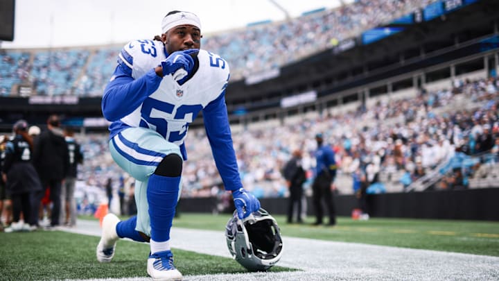 Dallas Cowboys defensive end James Houston kneels before the start of the game against the Carolina Panthers.