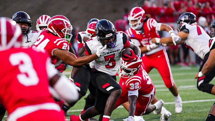 Corona Centennial running back bursts through the Mater Dei defense on Thursday, Aug. 22, 2024. Corona Centennial running back bursts through the Mater Dei defense on Thursday, Aug. 22, 2024.