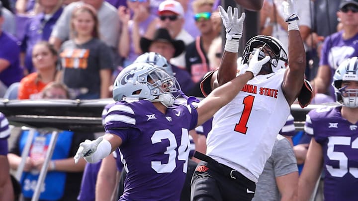 Sep 28, 2024; Manhattan, Kansas, USA; Kansas State Wildcats cornerback Jordan Dunbar (34) breaks up a pass intended for Oklahoma State Cowboys wide receiver De'Zhaun Stribling (1) during the fourth quarter at Bill Snyder Family Football Stadium. Mandatory Credit: Scott Sewell-Imagn Images Sep 28, 2024; Manhattan, Kansas, USA; Kansas State Wildcats cornerback Jordan Dunbar (34) breaks up a pass intended for Oklahoma State Cowboys wide receiver De'Zhaun Stribling (1) during the fourth quarter at Bill Snyder Family Football Stadium. Mandatory Credit: Scott Sewell-Imagn Images