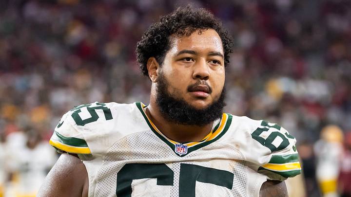 Green Bay Packers guard Aaron Banks (65) walks on