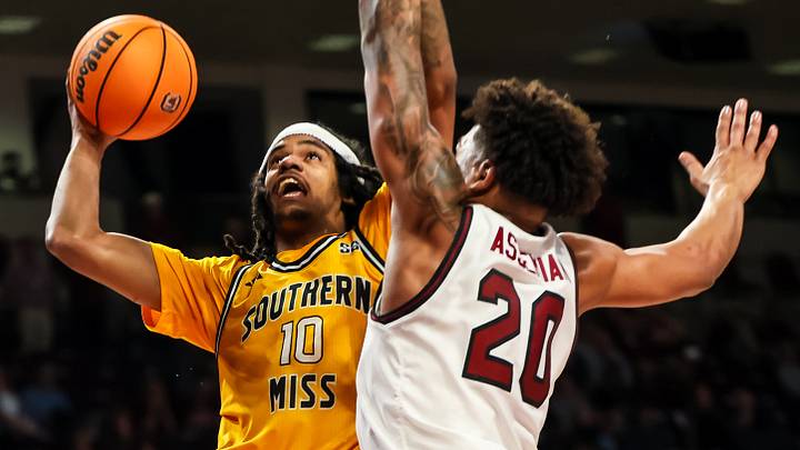 Nov 9, 2025; Columbia, South Carolina, USA; Southern Mississippi Golden Eagles guard Isaac Taveras (10) shoots over South Carolina Gamecocks forward Hayden Assemian (20) in the second half at Colonial Life Arena. Mandatory Credit: Jeff Blake Nov 9, 2025; Columbia, South Carolina, USA; Southern Mississippi Golden Eagles guard Isaac Taveras (10) shoots over South Carolina Gamecocks forward Hayden Assemian (20) in the second half at Colonial Life Arena. Mandatory Credit: Jeff Blake