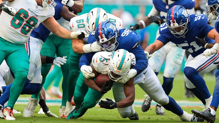 Miami Dolphins running back Jaylen Wright (5) runs with the football against New York Giants defensive tackle Zacch Pickens (96) during the first half at Hard Rock Stadium. 