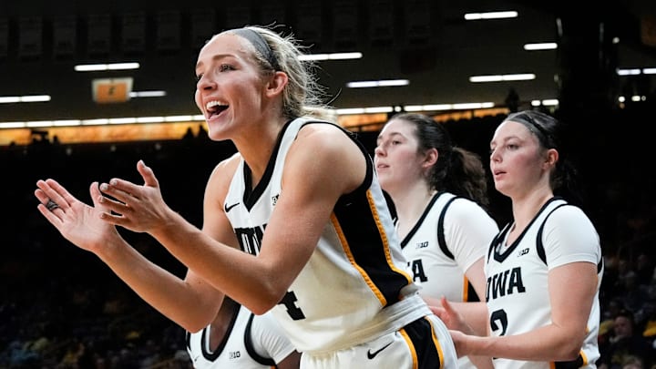 Iowa guard Kylie Feuerbach (4) cheers on her teammates Nov. 3, 2025 during a women’s college basketball game against the Southern Jaguars at Carver-Hawkeye Arena in Iowa City, Iowa.