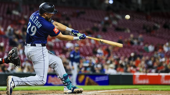 Seattle Mariners catcher Cal Raleigh hits a solo home run against the Cincinnati Reds on April 16 at Great American Ballpark.