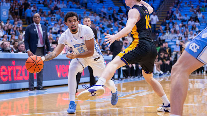 Dec 22, 2025; Chapel Hill, North Carolina, USA; c6 passes around East Carolina Pirates guard Patrick D'Arcy (10) during the second half at Dean E. Smith Center. Mandatory Credit: Scott Kinser-Imagn Images
