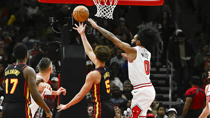 Jan 15, 2025; Chicago, Illinois, USA;  Atlanta Hawks guard Dyson Daniels (5) shoots against ]Chicago Bulls guard Coby White (0) during the first half at the United Center. Mandatory Credit: Matt Marton-Imagn Images