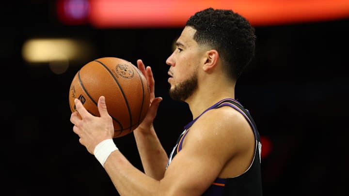 Apr 27, 2026; Phoenix, Arizona, USA; Phoenix Suns guard Devin Booker (1) against the Oklahoma City Thunder in the second half during game four of the first round of the 2026 NBA Playoffs at Mortgage Matchup Center. Mandatory Credit: Mark J. Rebilas-Imagn Images
