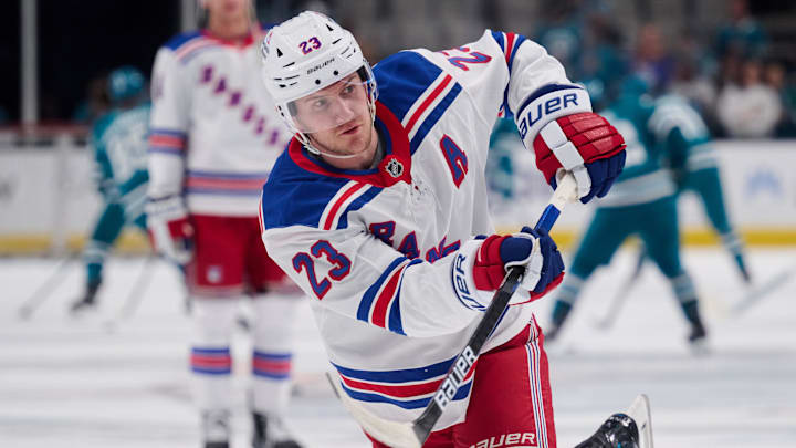 Mar 29, 2025; San Jose, California, USA; New York Rangers defenseman Adam Fox (23) warms up before the game against the San Jose Sharks at SAP Center at San Jose. Mandatory Credit: Robert Edwards-Imagn Images