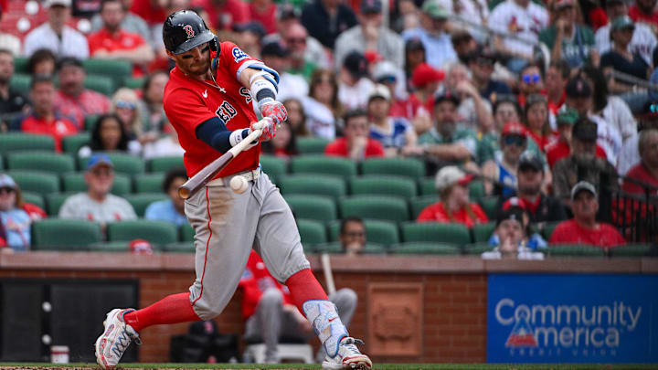 Apr 12, 2026; St. Louis, Missouri, USA; Boston Red Sox shortstop Trevor Story (10) hits a two run double against the St. Louis Cardinals during the ninth inning at Busch Stadium. Mandatory Credit: Jeff Curry-Imagn Images