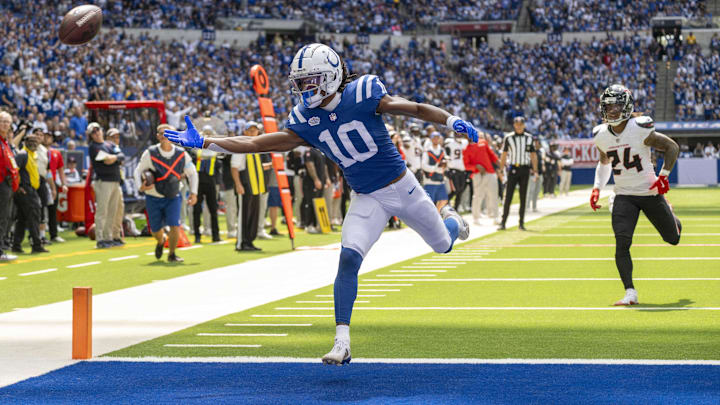 Sep 8, 2024; Indianapolis, Indiana, USA; Indianapolis Colts wide receiver Adonai Mitchell (10) reaches for an overthrown pass in front of Houston Texans cornerback Derek Stingley Jr. (24) during the second quarter at Lucas Oil Stadium. Mandatory Credit: Marc Lebryk-Imagn Images