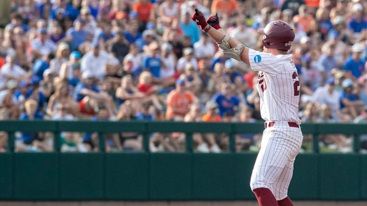 Gamecocks utility Ethan Petry (20) with a double in Game 2 of the NCAA Super Regional against