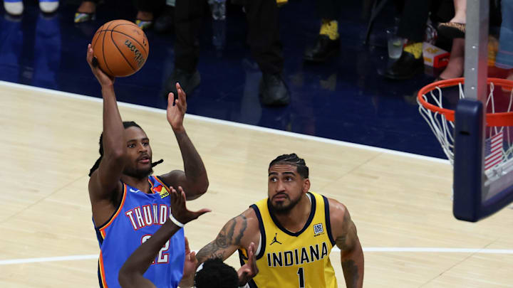 Jun 19, 2025; Indianapolis, Indiana, USA; Oklahoma City Thunder guard Cason Wallace (22) shoots the ball defended by Indiana Pacers forward Pascal Siakam (43) and forward Obi Toppin (1) in the fourth quarter during game six of the 2025 NBA Finals at Gainbridge Fieldhouse. Mandatory Credit: Trevor Ruszkowski-Imagn Images