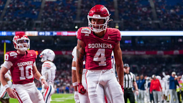 Dec 28, 2023; San Antonio, TX, USA; Oklahoma Sooners wide receiver Nic Anderson (4) celebrates a touchdown catch in the first half against the Arizona Wildcats at Alamodome. Mandatory Credit: Daniel Dunn-Imagn Images Dec 28, 2023; San Antonio, TX, USA; Oklahoma Sooners wide receiver Nic Anderson (4) celebrates a touchdown catch in the first half against the Arizona Wildcats at Alamodome. Mandatory Credit: Daniel Dunn-Imagn Images