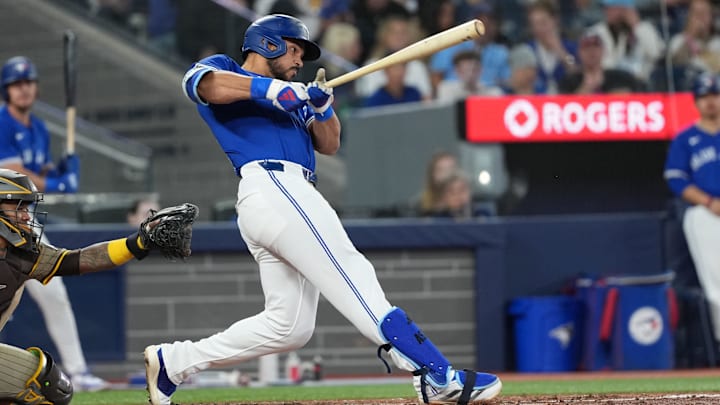 May 20, 2025; Toronto, Ontario, CAN; Toronto Blue Jays designated hitter Anthony Santander (25) hits a two-run home run against the San Diego Padres during the fifth inning at Rogers Centre. 