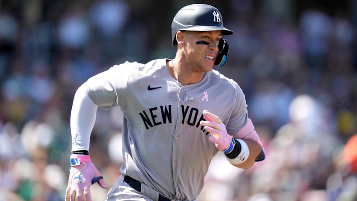 May 11, 2025; West Sacramento, California, USA; New York Yankees right fielder Aaron Judge (99) runs toward first base after hitting a single against the Athletics in the seventh inning at Sutter Health Park.