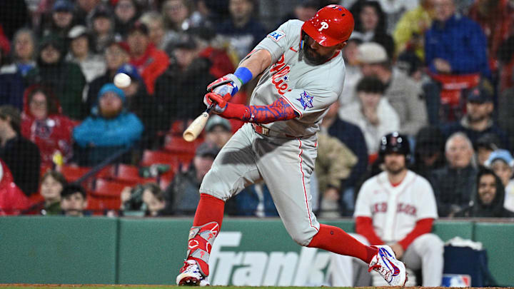 Philadelphia Phillies designated hitter Kyle Schwarber hits a two run home run  during the eighth inning against the Boston Red Sox at Fenway Park.